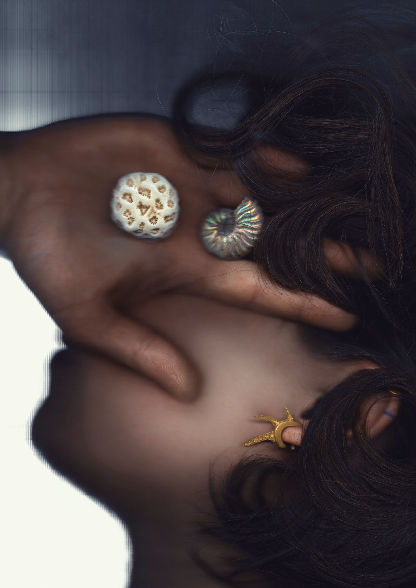 A pair of hand 18-karat gold earrings featuring granulation and casts of coral fragments. Handmade by Violette Stehli.