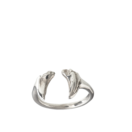 A delicate adjustable ring made from cats teeth cast in sterling silver using the lost wax casting technique.