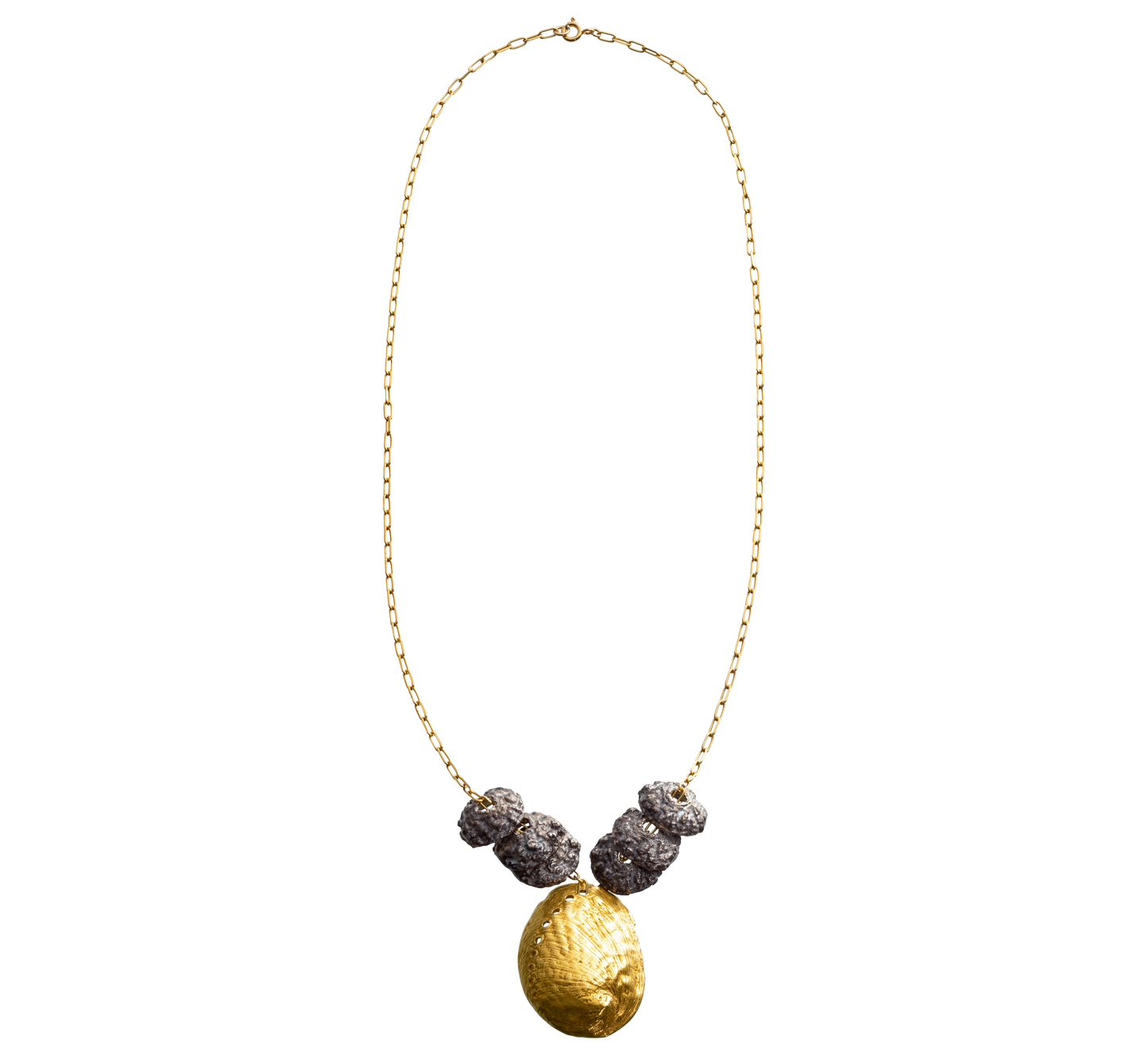 A sterling silver and gold vermeil necklace made from casts of eucalyptus seed caps and an abalone shell. Made by Violette Stehli.