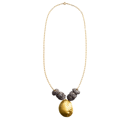 A sterling silver and gold vermeil necklace made from casts of eucalyptus seed caps and an abalone shell. Made by Violette Stehli.