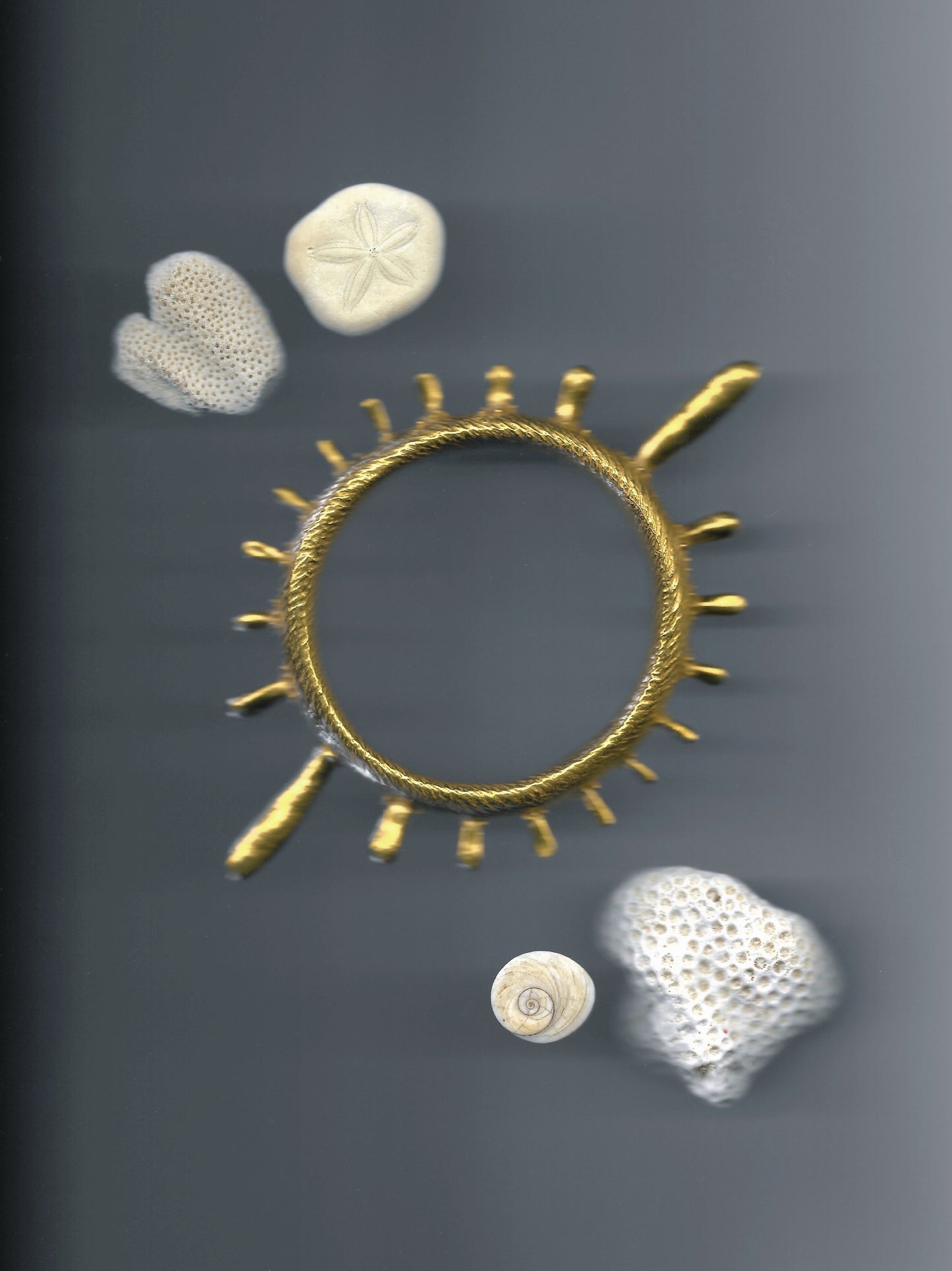 A colossal gold vermeil bangle adorned with sea urchin spines and delicate granulation details evoking ancient Etruscan jewelry. Made by Violette Stehli