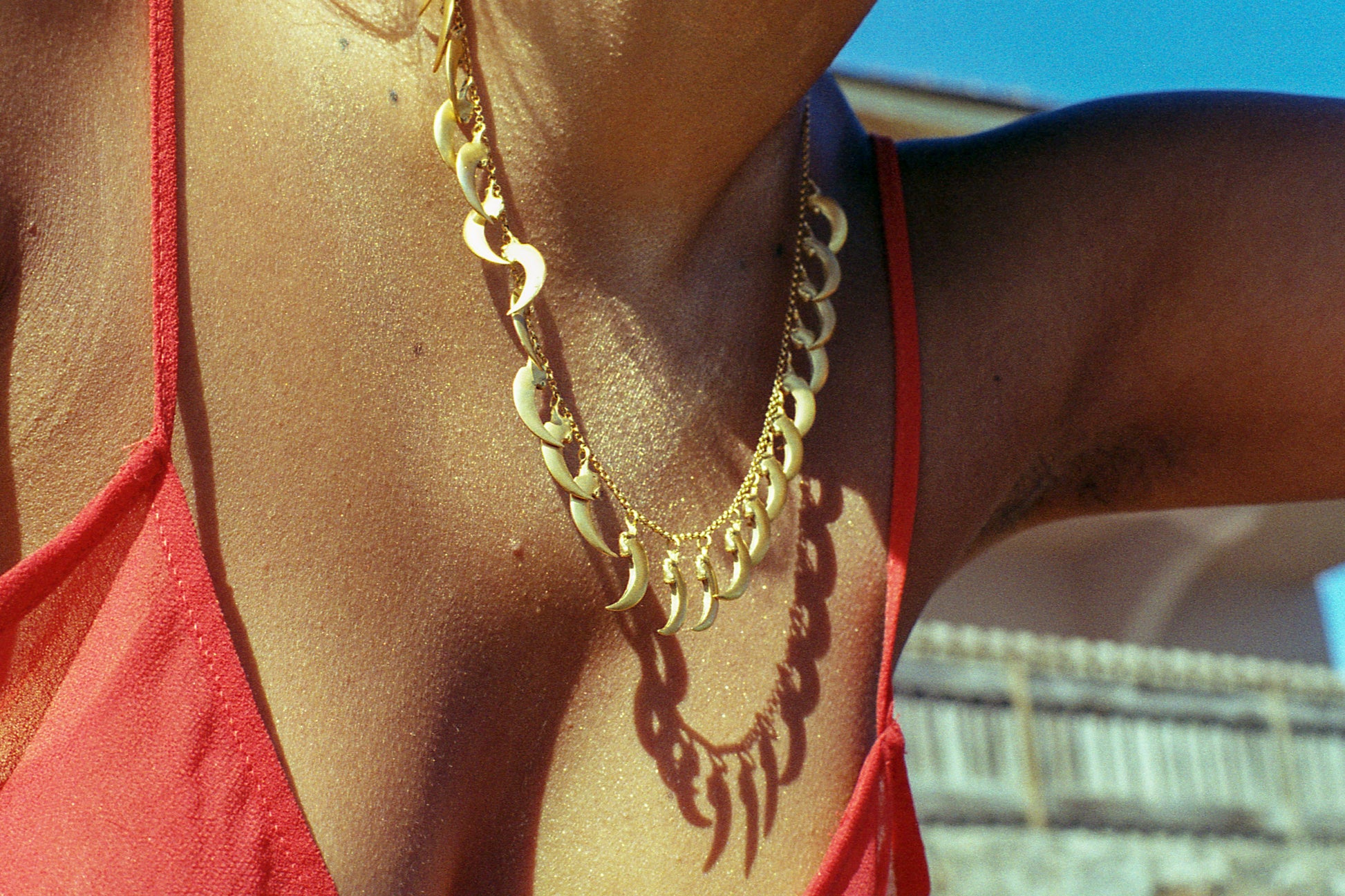 A photo of Eva wearing our gold vermeil bat claw necklace made with the lost-wax casting technique. Made by Violette Stehli. Photograph by Angélique Stehli.
