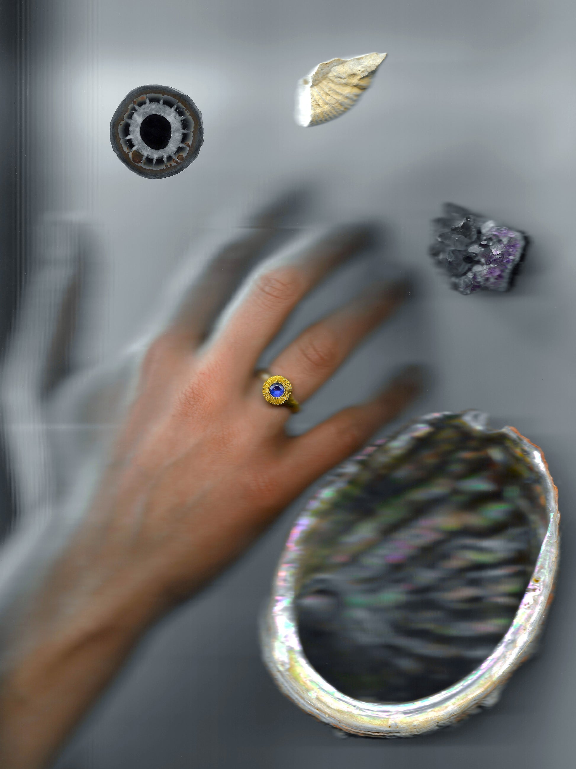 A hand sculpted, textured sterling silver ring set with a tanzanite. Made using the lost wax casting technique by Violette Stehli.