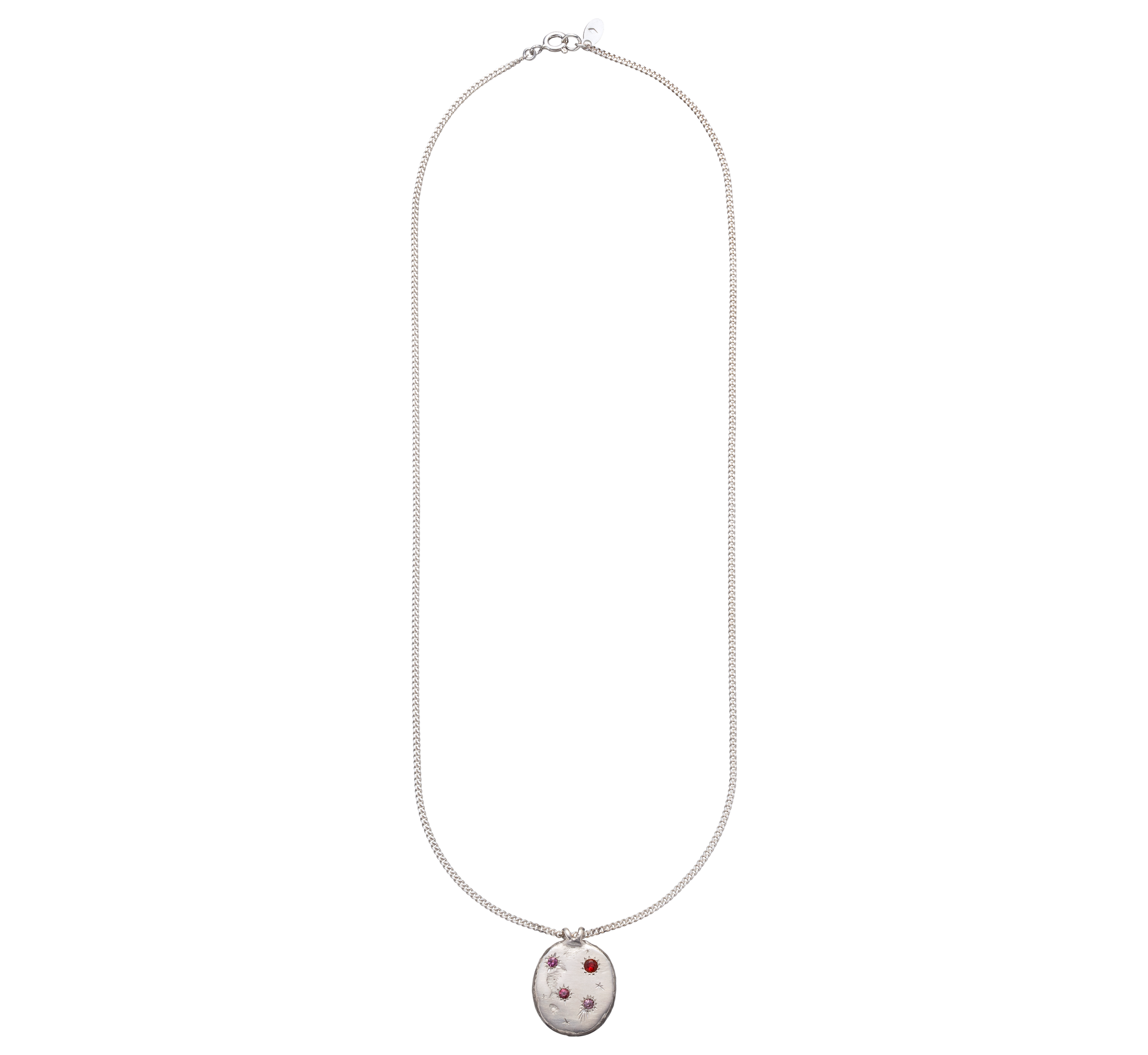 A precious but rough sterling silver medallion set with four precious stones and celestial engravings.