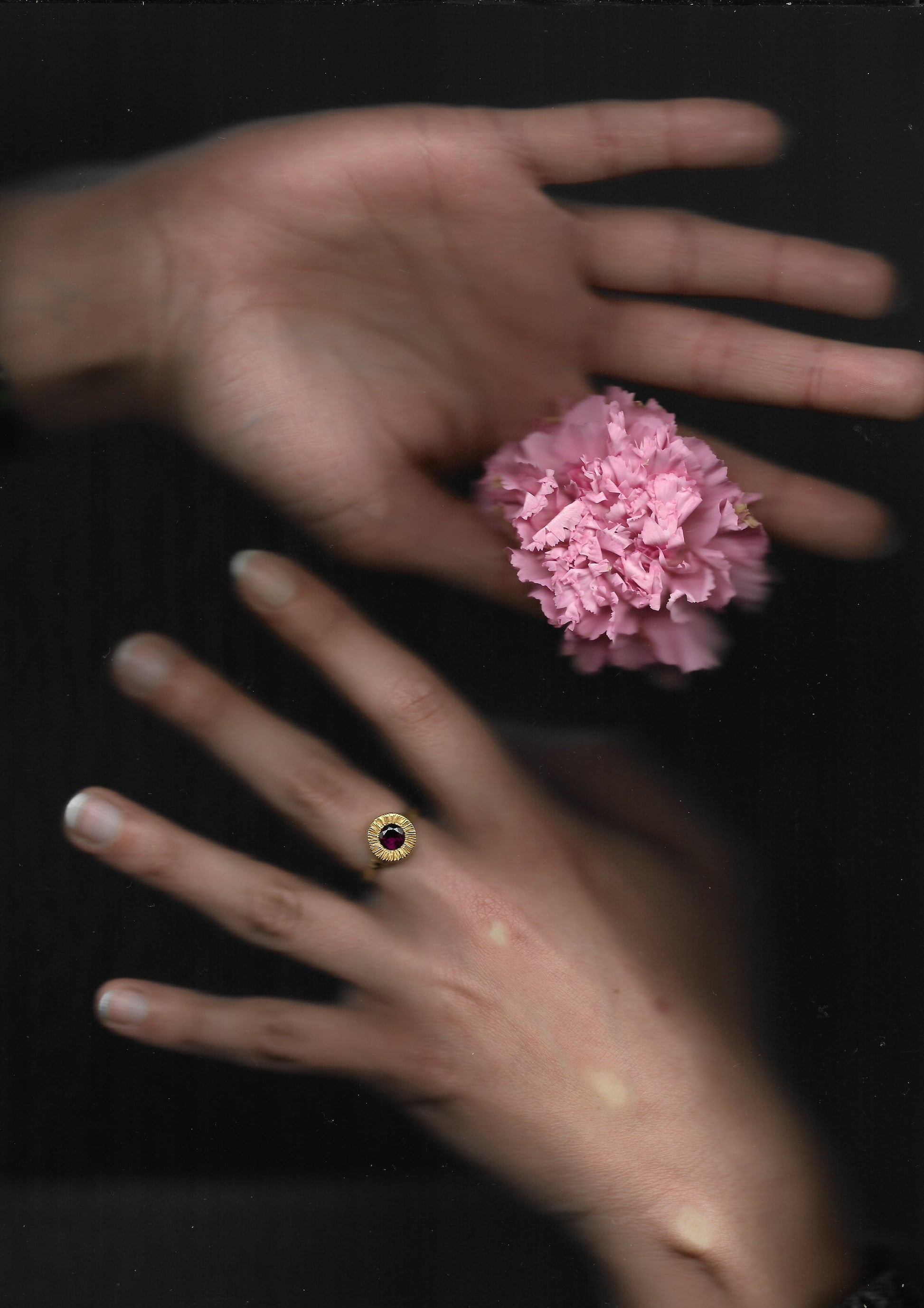 A hand sculpted, textured sterling silver ring set with a rhodolite garnet. Made using the lost wax casting technique by Violette Stehli.