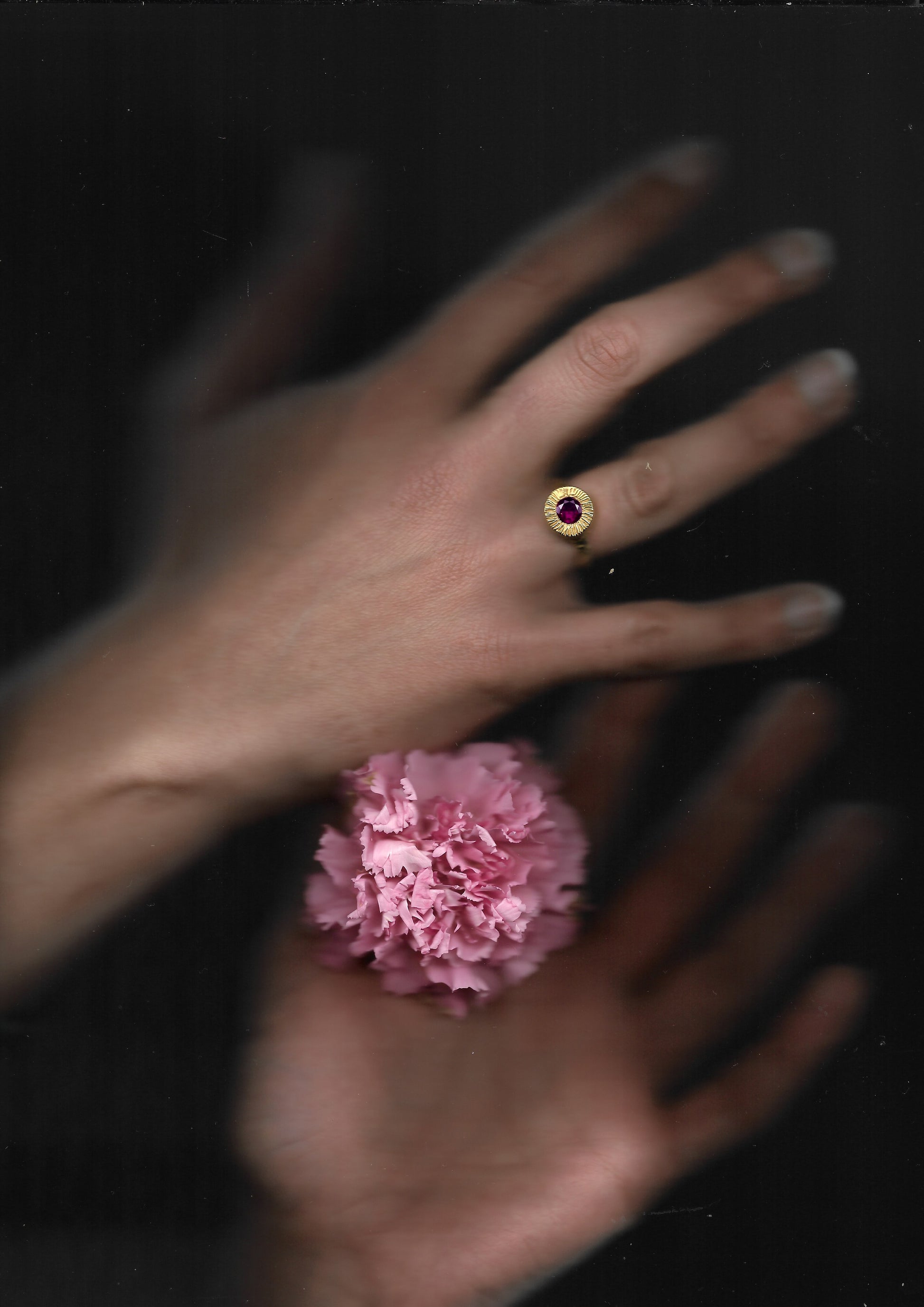 A hand sculpted, textured sterling silver ring set with a rhodolite garnet. Made using the lost wax casting technique by Violette Stehli.