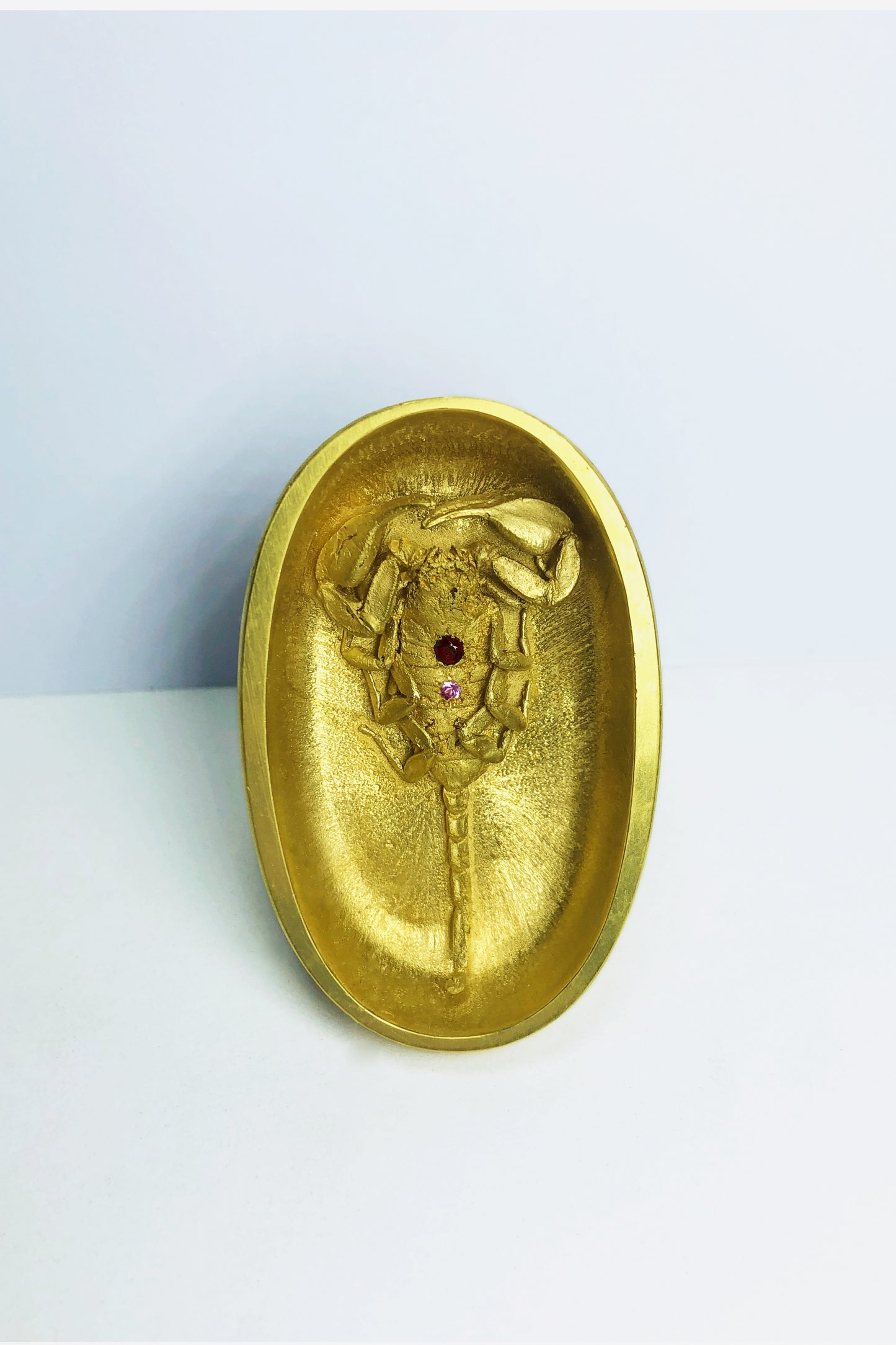 A massive vermeil ring made by Violette Stehli featuring a scorpion set with sapphire and garnet. The ring is made using the lost wax casting process.