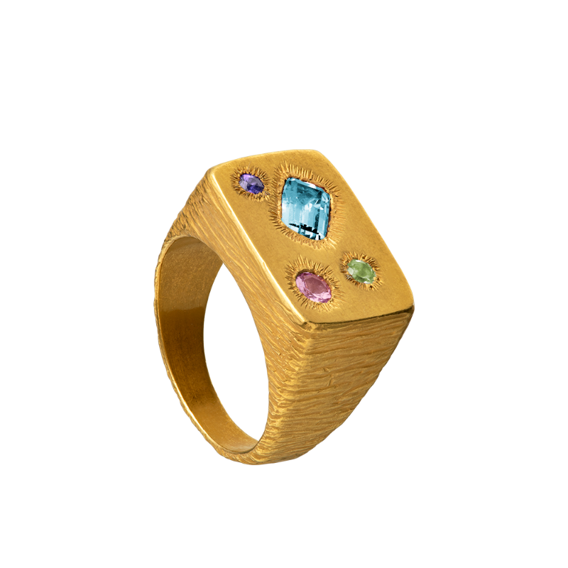 A rough but precious rectangular signet in 18-karat gold set with four precious stones. Hand sculpted by Violette Stehli.