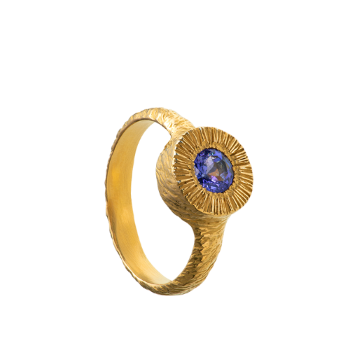 A hand sculpted, textured sterling silver ring set with a tanzanite. Made using the lost wax casting technique by Violette Stehli.