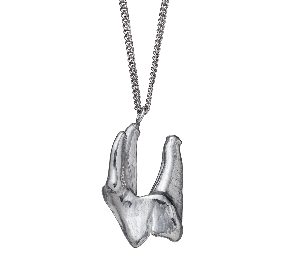 sterling silver pendant charm cast from a wolf's tooth on a rolo-link chain. Handmade by Violette Stehli.