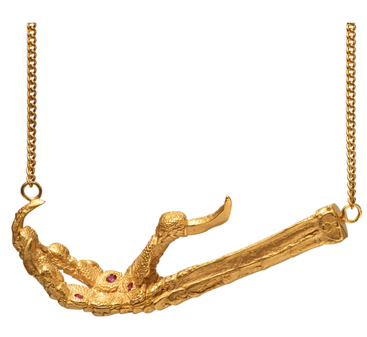 A necklace cast from a crows foot and set with rubies by Violette Stehli. The necklace is a choker on a curb-link chain.