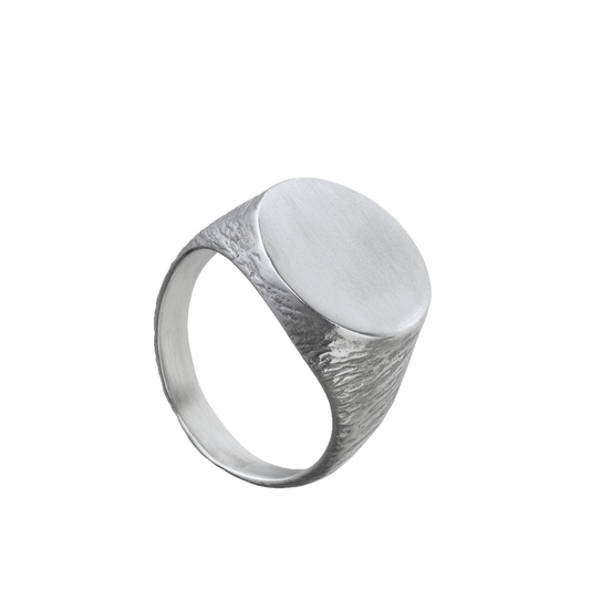 a delicate yet tough, handmade unisex ring for everyday wear made from Responsible Jewelry Council certified sterling silver. The band is textured and the surface is round and smooth.