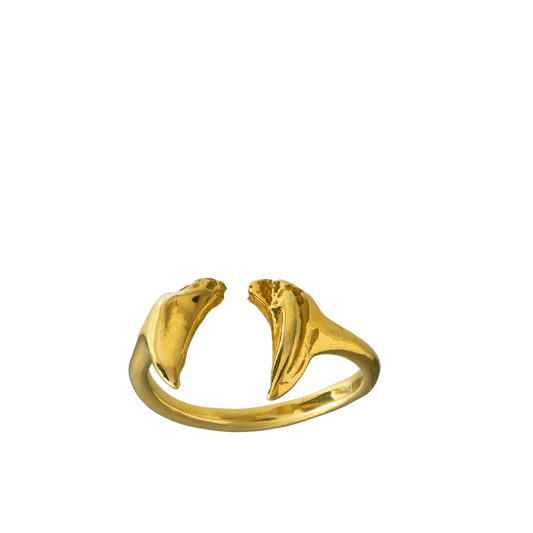 A delicate adjustable ring made from cats teeth cast in 18-karat gold using the lost wax casting technique.