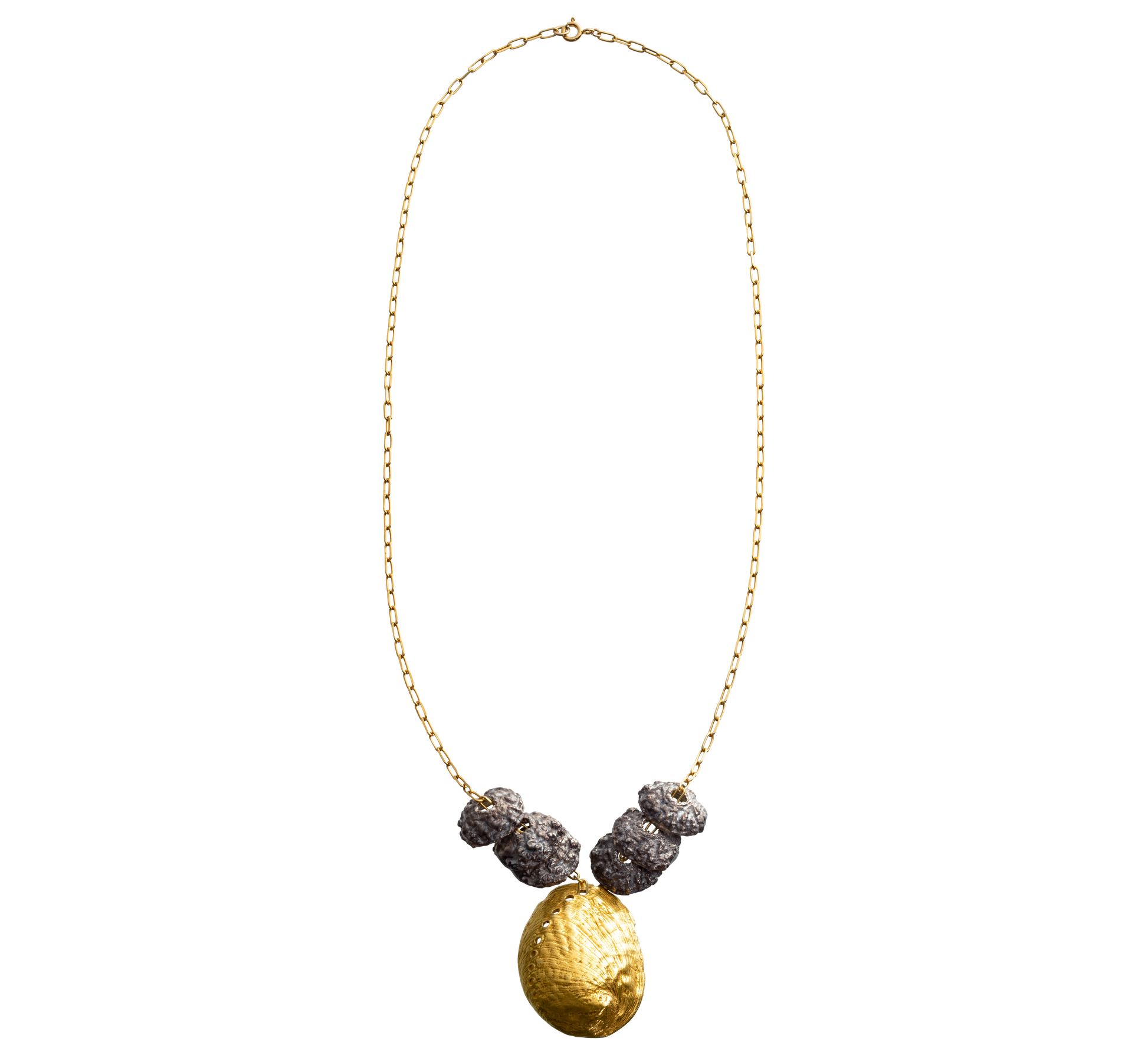 A sterling silver and gold vermeil necklace made from casts of eucalyptus seed caps and an abalone shell. Made by Violette Stehli