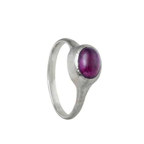 A delicate and textured sterling silver band set with an amethyst cabochon. Hand sculpted by Violette Stehli