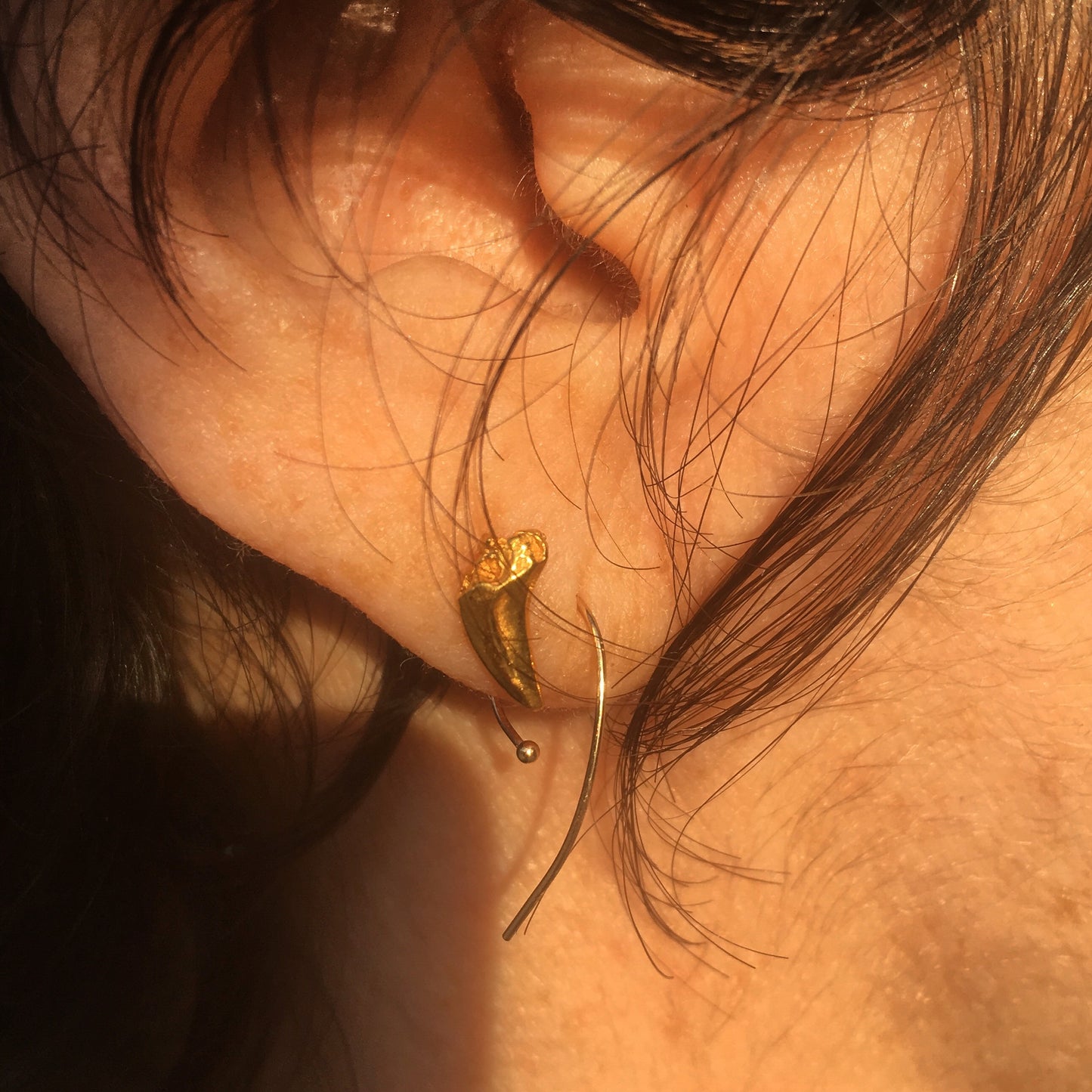 A small and delicate pair of stud earrings cast from sterling silver and made using the lost wax casting technique.