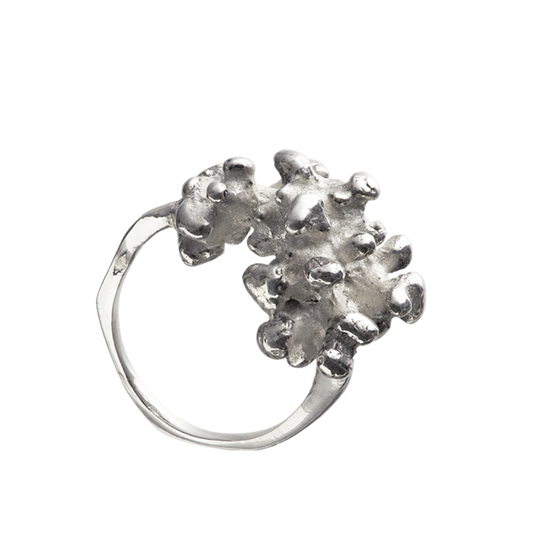 A sterling silver Responsible Jewellery Council certified gold coral ring. Handmade using the lost-wax casting technique. The piece of coral has been reproduced in silver.