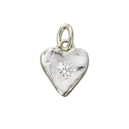 Silver heart-shaped pendant with a central diamond on a white background
