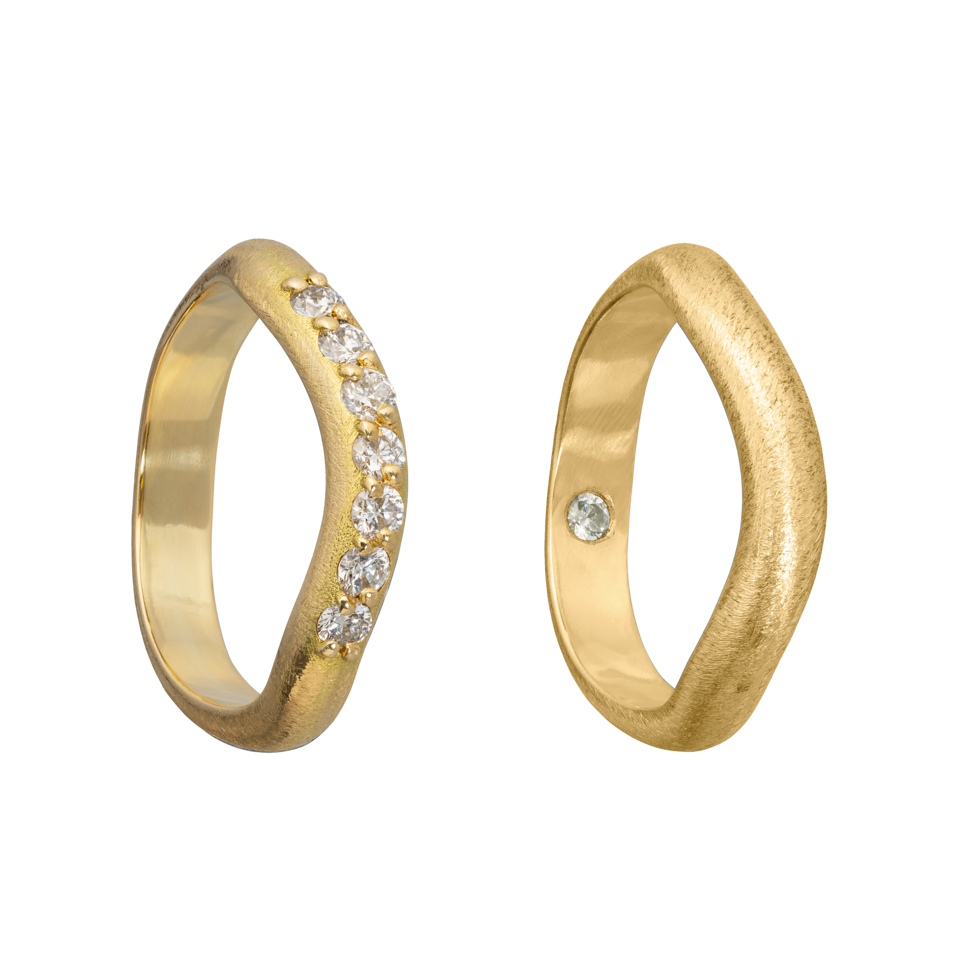 A set of handmade gold and diamond wedding bands inspired by the idea of the Vena Amoris
