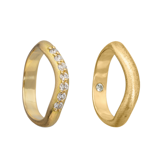 A set of handmade gold and diamond wedding bands inspired by the idea of the Vena Amoris