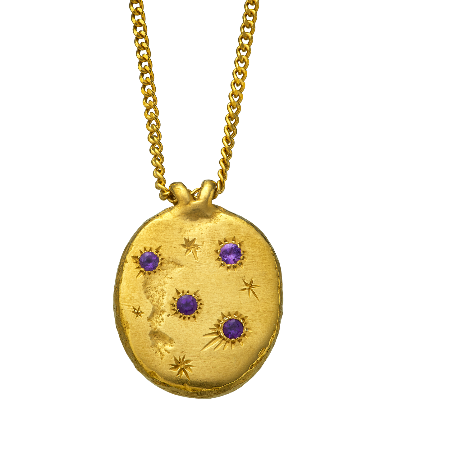 A precious but rough 18-karat gold medallion set with four amethysts and celestial engravings.