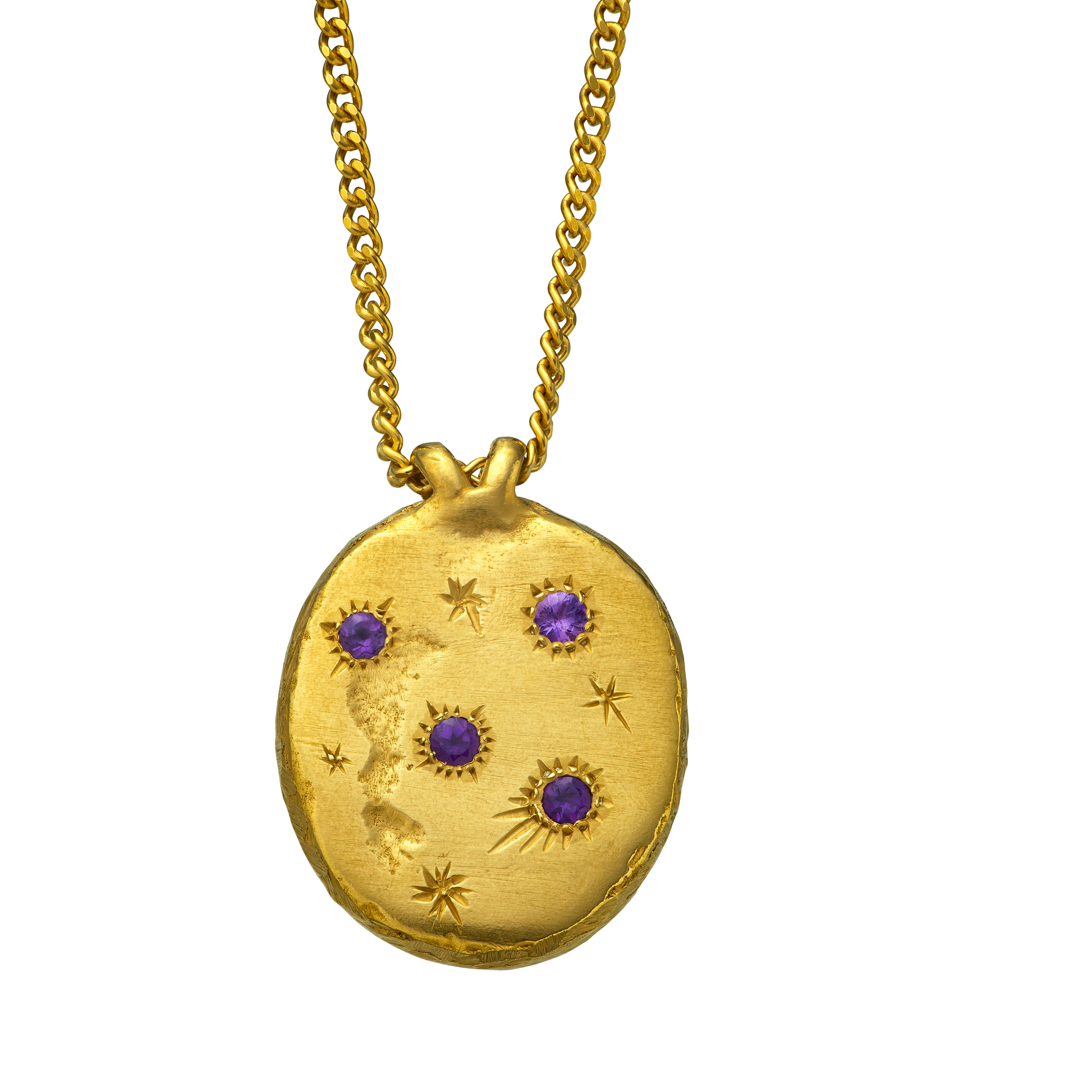 A precious but rough 18-karat gold medallion set with four amethysts and celestial engravings.