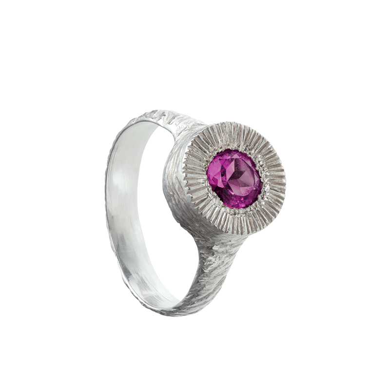 A hand sculpted, textured sterling silver ring set with a rhodolite garnet. Made using the lost wax casting technique by Violette Stehli.