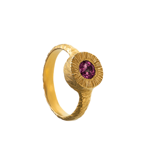 A hand sculpted, textured sterling silver ring set with a rhodolite garnet. Made using the lost wax casting technique by Violette Stehli.