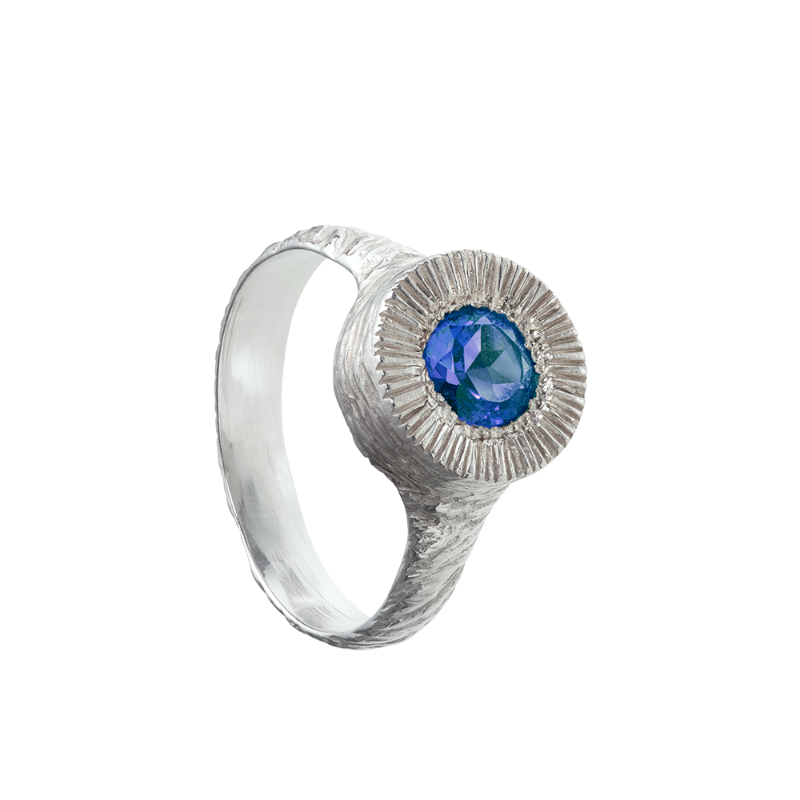 A hand sculpted, textured sterling silver ring set with a tanzanite. Made using the lost wax casting technique by Violette Stehli.