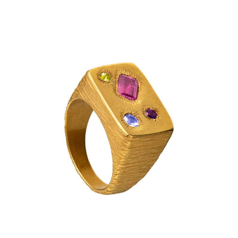 A rough but precious rectangular signet in 18-karat gold set with four precious stones. Hand sculpted by Violette Stehli.