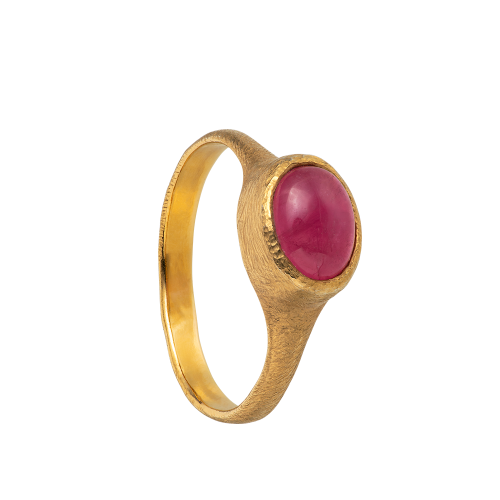 A delicate and textured 18-karat gold band set with a pink tourmaline cabochon. Hand sculpted by Violette Stehli