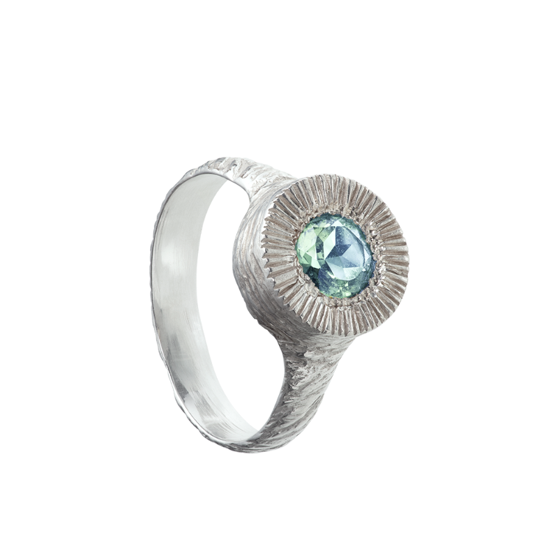 A hand sculpted, textured sterling silver ring set with a mint-green tourmaline. Made using the lost wax casting technique by Violette Stehli.