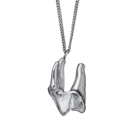 sterling silver pendant charm cast from a wolf's tooth on a rolo-link chain. Handmade by Violette Stehli.