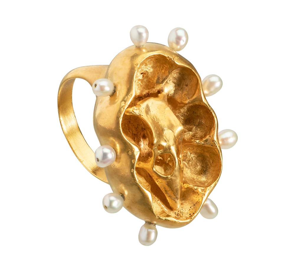 A gold vermeil ring with pearls and a sparrow skull. Evocative of medieval religious reliquaries. Hand sculpted by Violette Stehli.